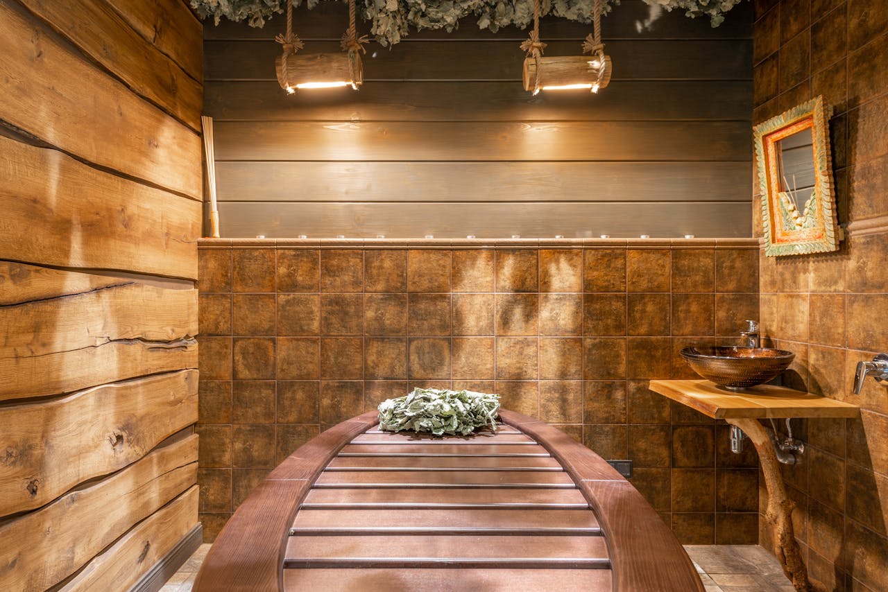 Cozy rustic sauna interior featuring wooden accents and natural decor for ultimate relaxation.
